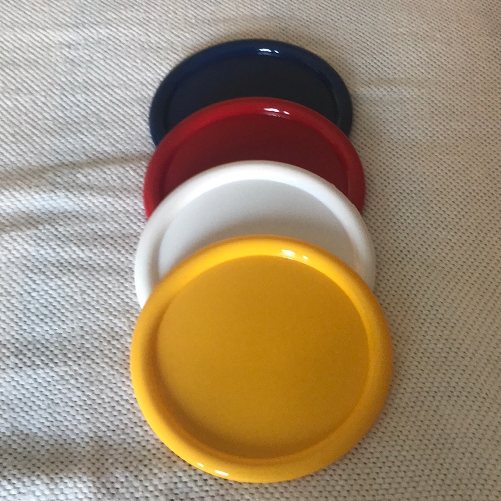 Plastic set-plates, cups, knives, forks, spoons, bowls, and cups.